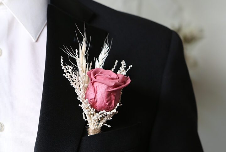 Natural Groom's floral wedding dark pink rose boutonniere